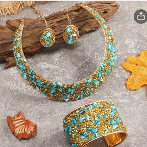 Turquoise bits on Goldtone spray metal (med size) jewelry set.